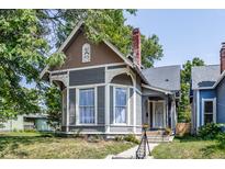 Gray and brown Victorian home with a charming front porch at 1715 Alabama St, Indianapolis, IN 46202