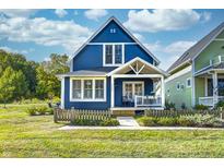 Beautiful blue house with white trim and porch at 10481 Dusty Rose Dr, Zionsville, IN 46077