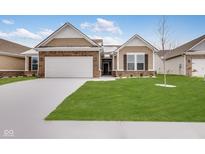 Modern two-story home with a neutral color palette and a neatly landscaped yard at 2081 Covey Dr, Danville, IN 46122