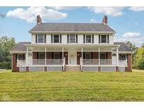 Brick and white two story home with large porch at 1633 Forestview Ln, Martinsville, IN 46151