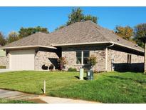 Brick ranch home with attached garage and landscaping at 2170 Galleone Way, Plainfield, IN 46168