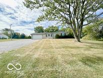 House with a gravel driveway and large yard at 11041 East 21St St, Indianapolis, IN 46229