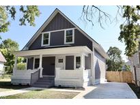House exterior boasts gray siding, white trim, and a welcoming porch at 3131 Boulevard Pl, Indianapolis, IN 46208