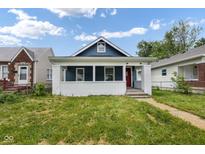 Charming house with a white picket fence at 1472 N Grant Ave, Indianapolis, IN 46201