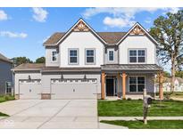 Two-story home with gray siding, white accents, and a three-car garage at 10620 Banyan Wood Ct, Indianapolis, IN 46239
