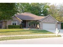 Brick ranch house with two-car garage and landscaping at 466 Sycamore Ridge Ct, Avon, IN 46123