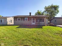 Ranch home with stone facade and covered porch at 222 Avalon Ln, Chesterfield, IN 46017