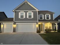 Two-story gray house with white shutters, two-car garage, and landscaping at 1130 Cobra Dr, Franklin, IN 46131