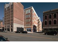 Brick building with commercial storefront and fire escape at 111 S Meridian St # 2, Indianapolis, IN 46225