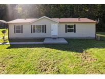 Tan mobile home with brown roof and small porch at 7242 N Stafford Ln, Martinsville, IN 46151