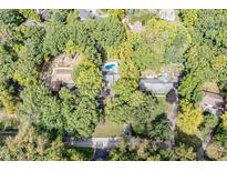 Aerial view of neighborhood with houses and lush green trees at 8954 Briarclift Rd, Indianapolis, IN 46256