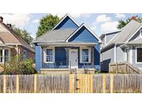 Blue house with white door and black accents at 1526 Lawton Ave, Indianapolis, IN 46203