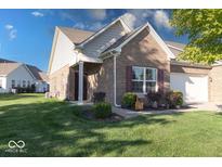 Brick front of charming ranch home with attached garage and landscaping at 1162 Meadowlark Dr, Greenwood, IN 46143