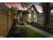 Charming cottage with a modern facade and landscaped yard at 701 E Morris St, Indianapolis, IN 46203