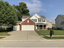 Two-story brick house with a two-car garage at 5211 Nicodemus Dr, Plainfield, IN 46168