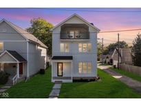Modern three-story home with balcony and lawn at 449 N Arsenal Ave, Indianapolis, IN 46201