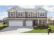 Two story home with gray siding and brick accents, two-car garage at 6429 Flag Stop Dr, Whitestown, IN 46075