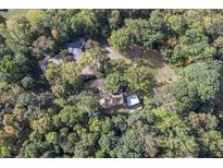 Aerial view of house and surrounding trees at 6470 Around The Hills Rd, Indianapolis, IN 46226