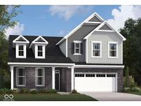 Two story home with gray siding, stone accents, and a 2-car garage at 5710 Cloister Ln, McCordsville, IN 46055