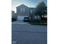 Two-story brick home with a two-car garage at 1449 Danielle Dr, Indianapolis, IN 46231
