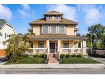 Two story house with front porch and brick steps at 814 E 23Rd St, Indianapolis, IN 46205