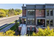 Brick front exterior with gray accents and a porch at 456 Monon Way Dr, Carmel, IN 46032
