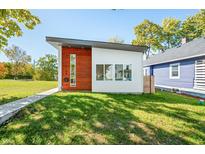 Modern, two-toned home with a landscaped lawn at 318 N Tacoma Ave, Indianapolis, IN 46201