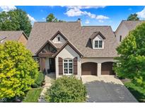 Stunning two-story home with a three-car garage at 15571 Bridgewater Club Blvd, Carmel, IN 46033