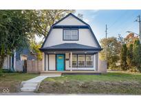 Charming 2-story house with a newly renovated front porch and landscaping at 2221 E Michigan St, Indianapolis, IN 46201