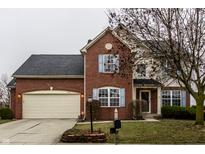 Brick house with two-car garage and landscaping at 19420 Golden Meadow Way, Noblesville, IN 46060