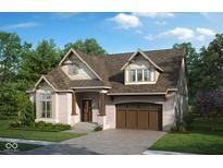 Brick home with a 2-car garage, dormer windows, and landscaped lawn at 947 W 146Th St, Carmel, IN 46074