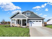 Craftsman style home with gray siding and white trim at 7144 Rose Hill Ave, Brownsburg, IN 46112