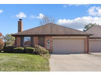 Brick ranch home with attached garage and well-maintained landscaping at 521 Eagle Crest Dr, Brownsburg, IN 46112