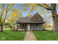 Renovated craftsman home with brick walkway at 320 S Howard St, Summitville, IN 46070