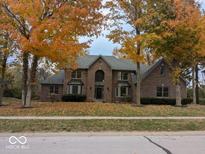 Brick two-story home with fall foliage at 6362 Harmonridge Ct, Indianapolis, IN 46278