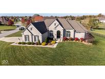 Luxury home with expansive lawn and 3-car garage, situated in a desirable neighborhood at 7610 Monte Carlo Way, Indianapolis, IN 46278