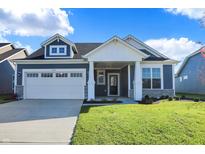 Craftsman style home with blue siding, white trim, and a two-car garage at 7149 Rose Hill Ave, Brownsburg, IN 46112