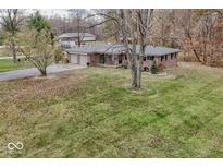 Ranch home with two-car garage and large backyard at 8190 Beech Grove Rd, Martinsville, IN 46151