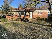 Brick ranch house with a neat front yard at 4025 N Campbell Ave, Indianapolis, IN 46226