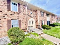 Brick building exterior with landscaping and walkway at 1632 Wellesley Ct # 6, Indianapolis, IN 46219