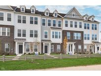 New townhouses with brick and siding, featuring a welcoming front yard at 1836 Blenker Dr, Carmel, IN 46032