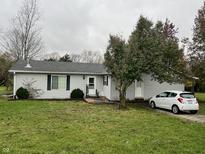 Ranch-style home with gray siding and a small yard at 3149 E 900 S, Flat Rock, IN 47234
