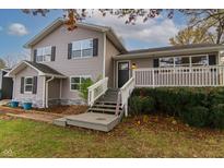 Two-story house with gray siding, white trim, and a deck at 2355 W State Road 234, Fortville, IN 46040