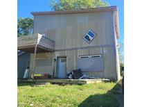 Two-story house with gray siding, a small balcony, and a partially visible yard at 2845 Forest Manor Ave, Indianapolis, IN 46218