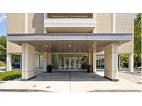 Modern building entrance with covered walkway and stylish design at 3965 N Meridian St # 7E, Indianapolis, IN 46208
