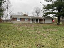 Brick ranch home with attached garage and large yard at 11 S 1050 W, Jamestown, IN 46147