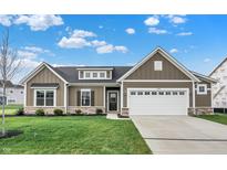 New construction home features a charming exterior with stone accents and a two-car garage at 7098 Sterling Way, Brownsburg, IN 46112