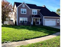 Two-story house with a spacious lawn and attached two-car garage at 636 Creston Point Cir, Indianapolis, IN 46239