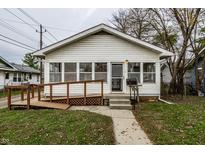 White house with porch, ramp, and small yard at 1708 S Randolph St, Indianapolis, IN 46203