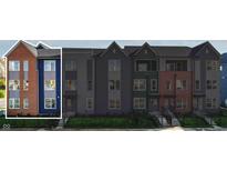 Modern 3-story townhome with brick and blue siding, steps, and a small yard at 2151 N College Ave, Indianapolis, IN 46202